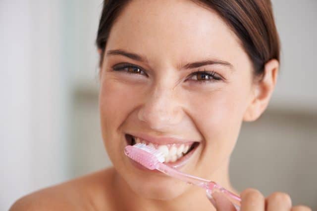 Brushing her teeth