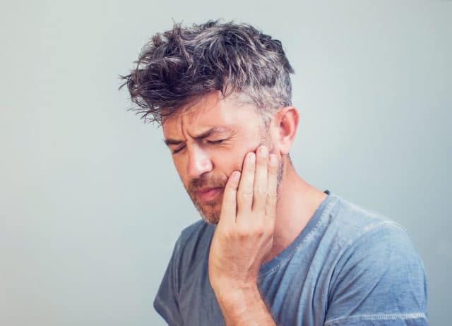 man with tooth pain
