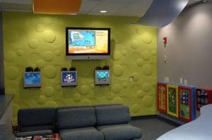 Woodbury pediatric interior shot of a waiting room with seating and tvs